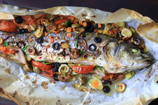 Baked sea bass with vegetables. stock photo