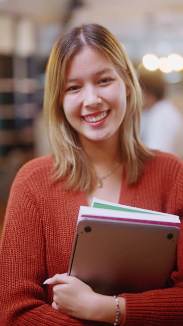 Portrait of a Clever Student Smiling and Facing the Camera