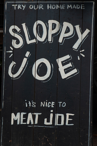Sloppy Joe Sign on a black wooden board with white writing