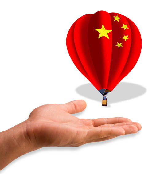china balloon over hand. - chinese spy balloon stok fotoğraflar ve resimler