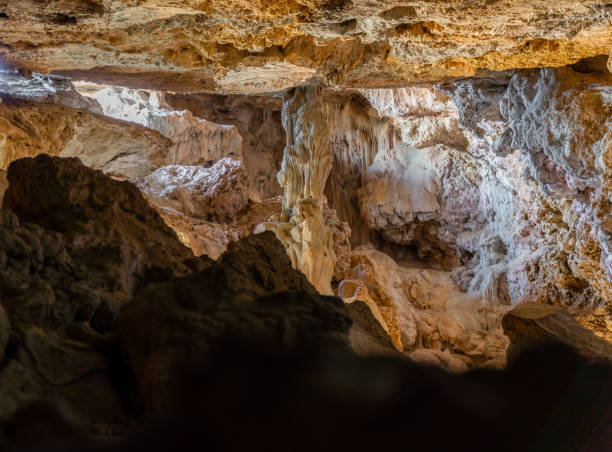 istock Interior of a dark cave with rock formations 1463127206