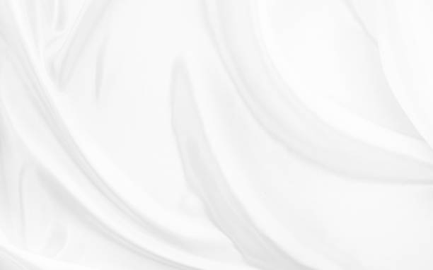 istock White gray satin texture that is white silver fabric silk background with beautiful soft blur pattern natural. 1463129020