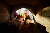 To kindle wood burning stove, villager uses birch bark.