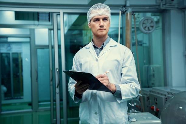 istock Apothecary scientist recording information from a CBD oil extractor. 1463129748