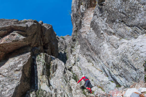 Sportsman jumping over cliffs