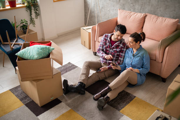 istock Couple sitting in new home 1463133826