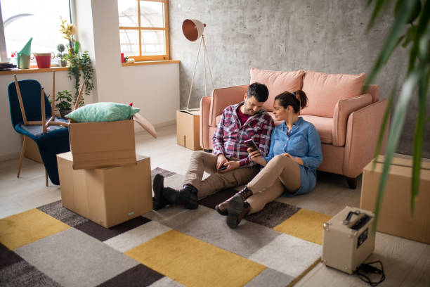 istock Couple sitting in new home 1463133849