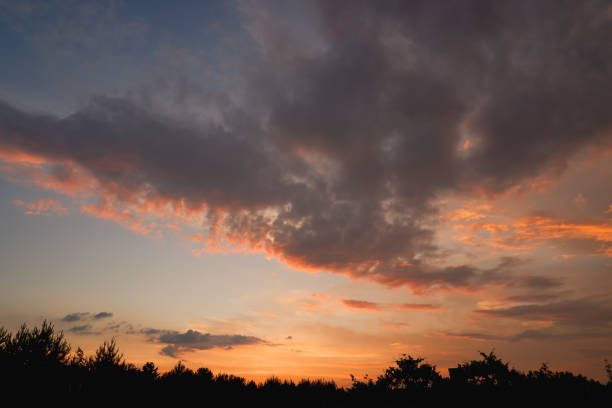 istock The sky at sunset before bad weather. Low red sunlight illuminates thunderclouds. 1463140250
