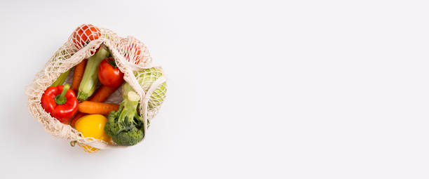 istock Fresh vegetables in a bag on a white background. Top view, flat lay. Banner 1463141928