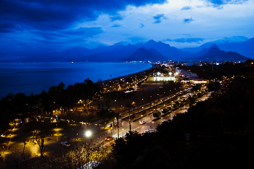 A city landscape photograph taken during the blue hour of a winter day.