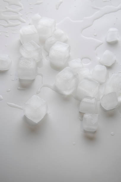 istock Ice cubes with water drops scattered on white background. Top view, flat lay 1463143832