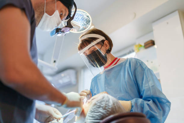 istock Female Assistance Working at Dentist Clinic 1463145126