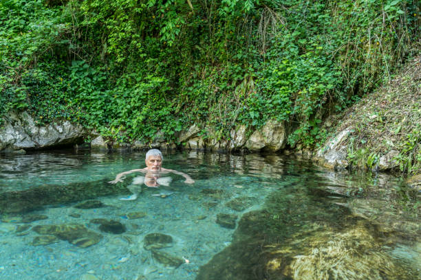 istock Senior man enjoying natural hot spa 1463155390