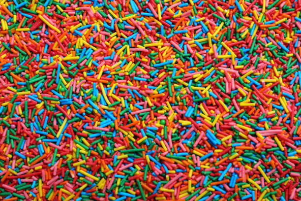 istock Bright colorful sprinkles as background, top view. Confectionery decor 1463162356
