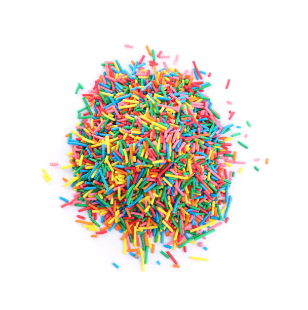 istock Colorful sprinkles on white background, top view. Confectionery decor 1463163539