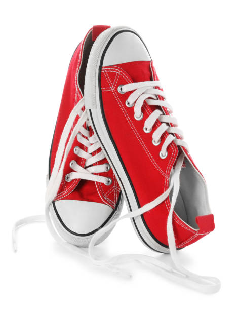 istock Stylish red canvas shoes with laces on white background 1463167610