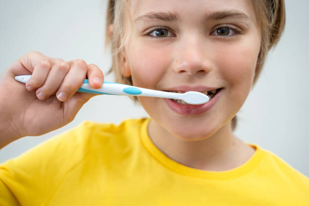 istock SchoolBoy Brush Teeth Child Looking At Camera Over White Background, Dentistry, Stomatology, Dental Care Hygiene With Toothbrush Toothpaste, Morning Evening Routine, Lifestyle, Health Care. 1463177865