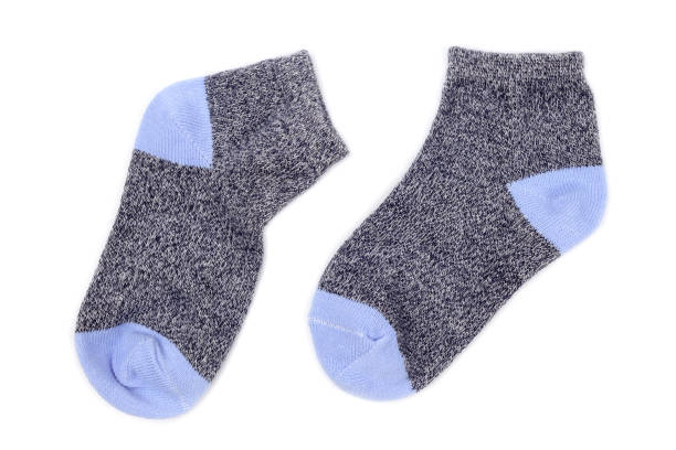 istock Pair of cute baby socks isolated on white 1463178178