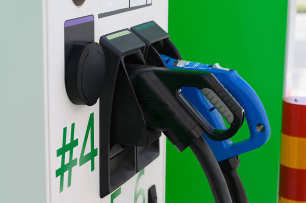 istock Electric Car Charging Gun at Charging Station 1463179912