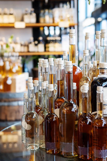 istock Bottles with alcoholic drinks and shelves with cognac, gin and rum. 1463192101
