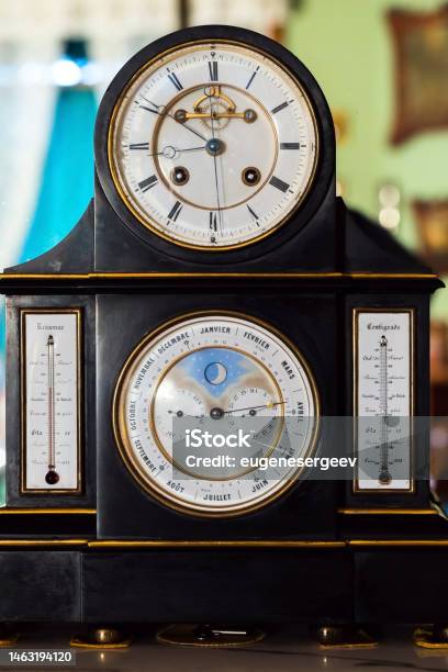 Vintage Table Clock With White Deal And Retrograde Calendar Stock Photo - Download Image Now