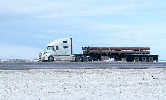 Calgary, Alberta, Canada. February 03, 2023. A truck hauling freight along the Queen Elizabeth II Highway.