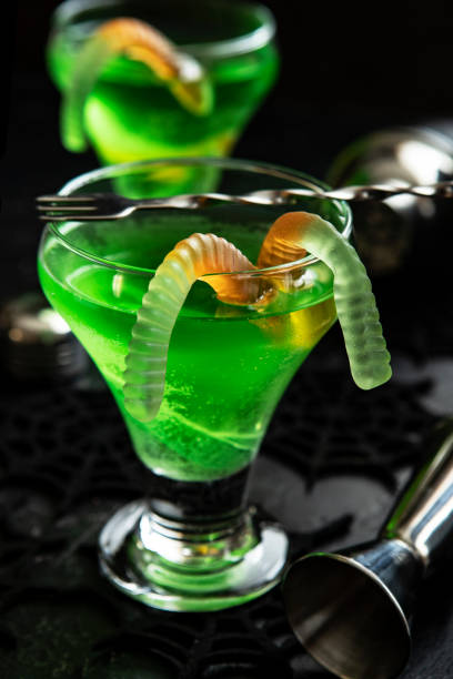 istock Green witch drink  in glass with  worms 1463198757