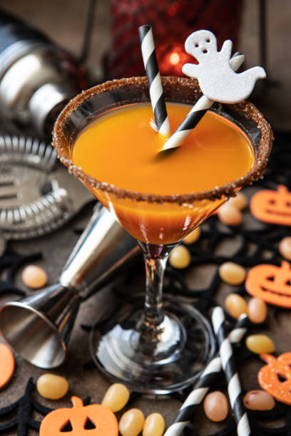 istock Autumn pumpkin cocktail with Halloween decor on  dark  background 1463198782