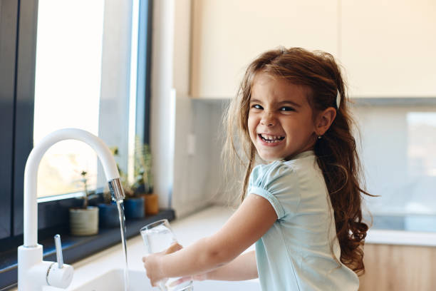 Beautiful girl drinking water