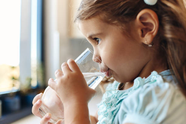 istock Beautiful girl drinking water 1463207070