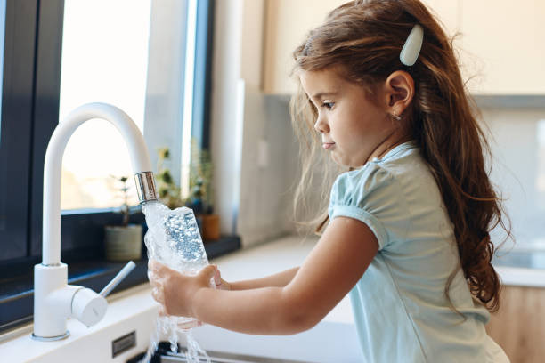 istock Beautiful girl drinking water 1463207145