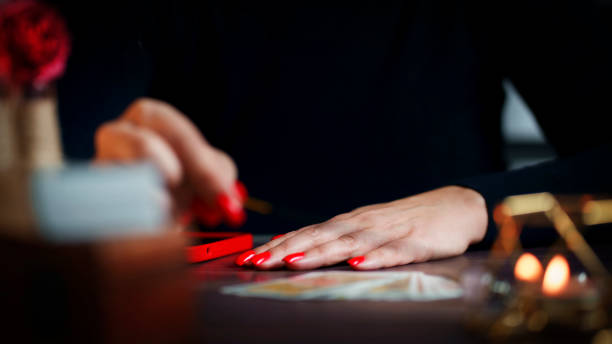 istock Defocused still Life with tarot cards. magic or fortune telling rite with occult and esoteric symbols. 1463210545