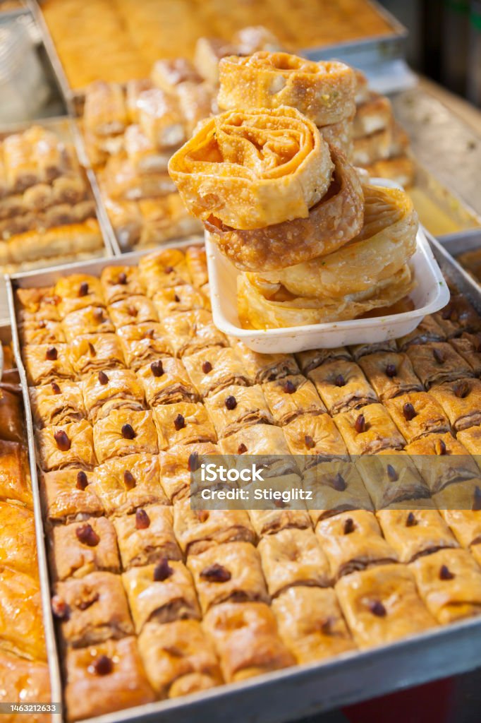 Baklava and other pastries at Carmel Market, Tel Aviv Trays of baklava, knafeh, and other sweet pastries for sale at Carmel Market  (Shuk Hacarmel), Tel Aviv Almond Stock Photo