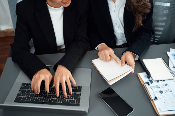 istock Closeup to view hand using laptop to analyze financial data in harmony office. 1463216177
