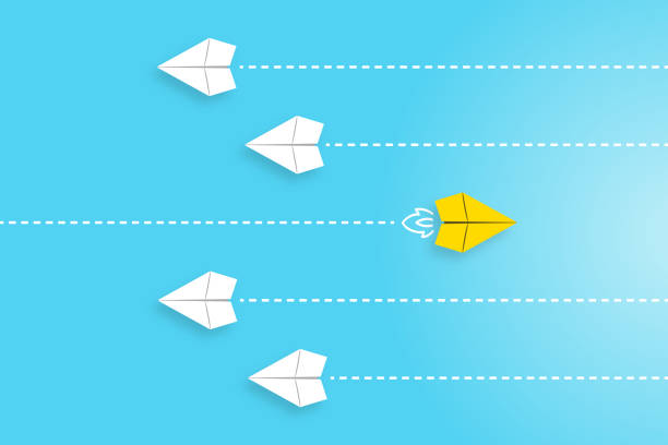 istock Change concepts with yellow paper airplane leading among white 1463219596