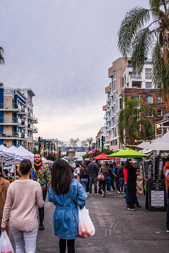 San Diego, CA - December 17, 2022: Shoppers at the Little Italy Farmer's Market.