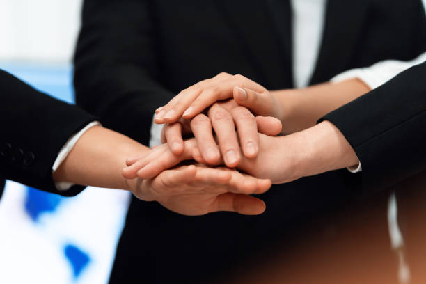 istock Top view closeup business team join hand stack together for harmony concept. 1463223289