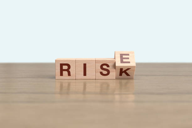 istock Wooden block cube flipping RISK to RISE 1463224274
