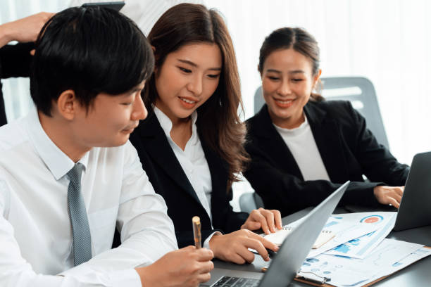 istock Office worker and manager analyze financial report paper in harmony workplace. 1463226664