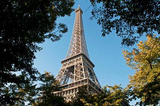 Paris, France, Sept. 26, 2018: The iconic Eiffel Tower is framed by trees in a Paris park.