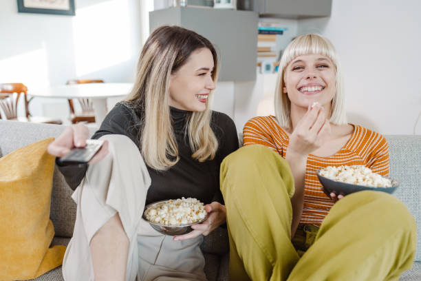 istock Young people watching TV at home 1463236802