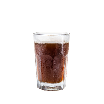 soft drink being poured into glass, shot with selective focus