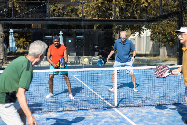 istock Four seniors playing padel in doubles 1463252012