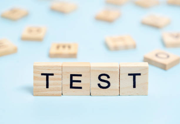 TEST word on wooden cube blocks. Medical concept