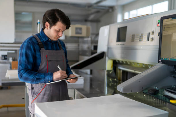 istock It's not easy working in a printing house. 1463254990