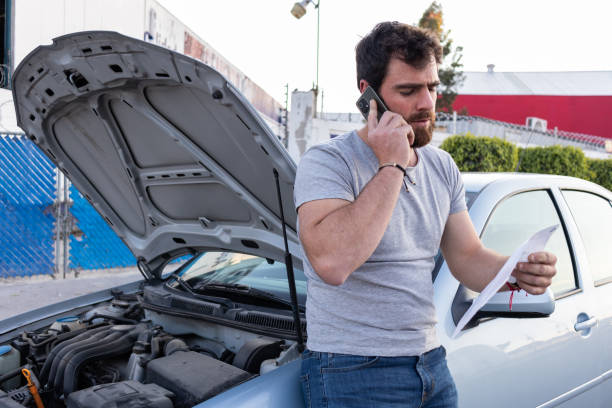 istock young man having car engine problems on the road calling asking for help to car insurance 1463258725