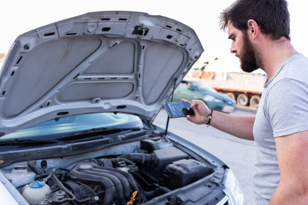istock young man having car engine problems on the road calling asking for help to car insurance 1463259516