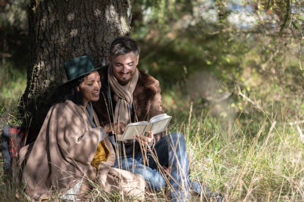 istock A romantic date of lovers under the tree. 1463260251