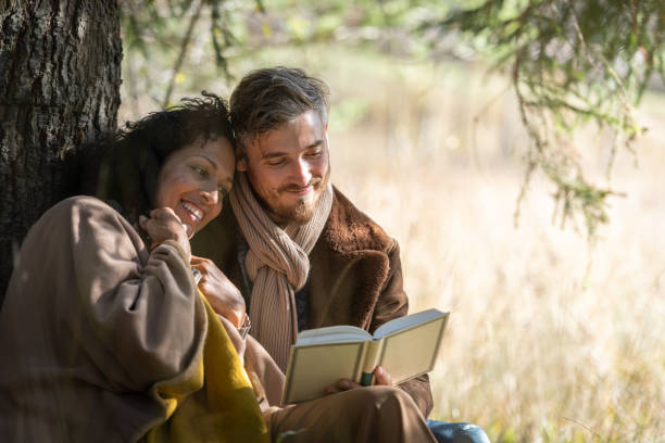istock A romantic date of lovers under the tree. 1463260260