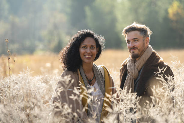istock A romantic walk of lovers on the grass. 1463263492
